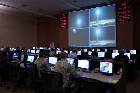 Members of the 576th Flight Test Squadron monitor an operational test launch of an unarmed Minuteman III missile at Vandenberg Air Force Base, California, U.S., March 27, 2015. Picture taken March 27, 2015. To Match Special Report USA-NUCLEAR/ICBM U.S. U.S. Air Force/Michael Peterson/Handout via REUTERS