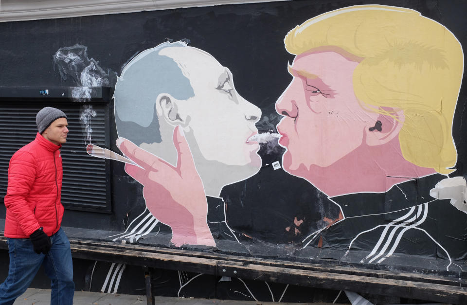 A mural of U.S. President Donald Trump (R) and Russian President Vladimir Putin 'shotgunning' a marijuana joint is seen on March 17, 2017 in Vilnius, Lithuania.