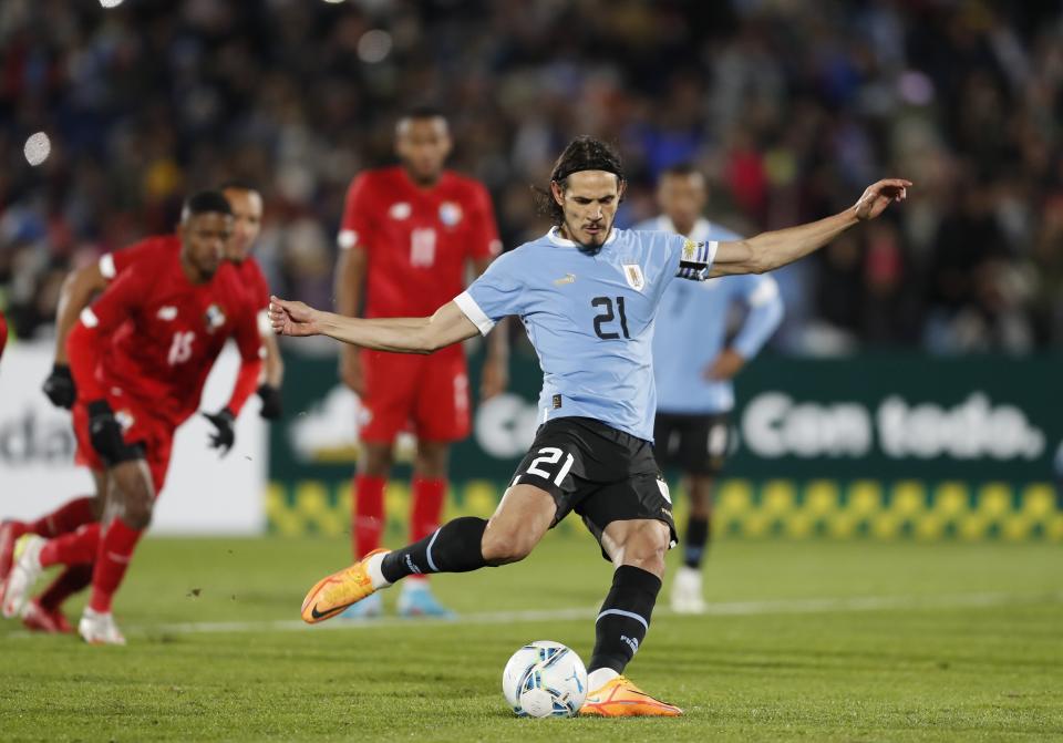 FILE - Uruguay's Edinson Cavani kicks a penalty shot and scores during a friendly soccer match against Panama at Centenario Stadium in Montevideo, Uruguay, Saturday, June 11, 2022. Cavani is back scoring again and that's good news for Uruguay ahead of potentially his last World Cup. The 35-year-old striker moved to Valencia in the search for playing time ahead of the tournament in Qatar but failed to score in his first three games with the club. (AP Photo/Matilde Campodonico, File)