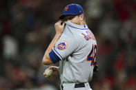 New York Mets starting pitcher Jacob deGrom wipes his face after allowing a solo home run to Atlanta Braves' Matt Olson during the second inning of a baseball game Friday, Sept. 30, 2022, in Atlanta. (AP Photo/John Bazemore)