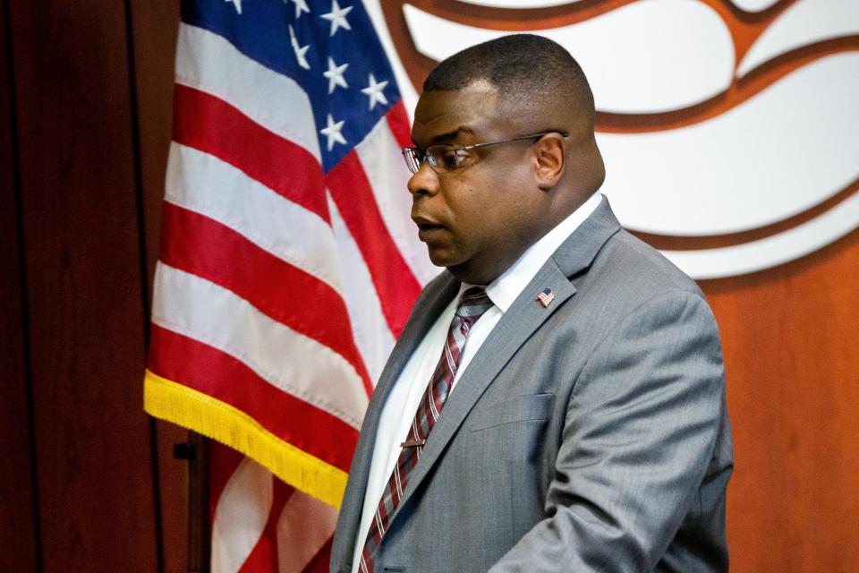 County Administrator John Gibbs walks to his seat before the start of the board of commissioners Tuesday meeting July, 25, 2023, at the county's Filmore Complex.