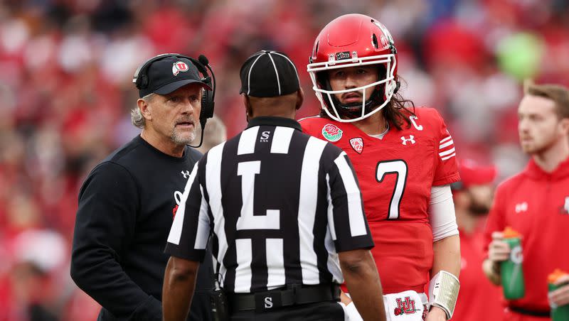 Utah head coach Kyle Whittingham and QB Cameron Rising listen to a official as Utah and Penn State prepare to play in the Rose Bowl in Pasadena, California, on Monday, Jan. 2, 2023. Both will be back in 2023, where the Utes will look to make it a three-peat as conference champs.