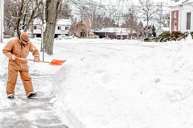 Blizzard of 2015: A New Jersey man tosses a full shovel of snow onto a large snow pile. Photo: Getty
