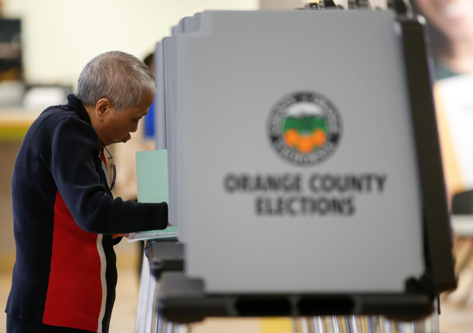 A voters cast their ballots in the March 3 Super Tuesday primary as new voting procedures and technology are used to make voting easier and more secure in Santa Ana, California, U.S., February 24, 2020. Picture taken February 24, 2020.      REUTERS/Mike Blake