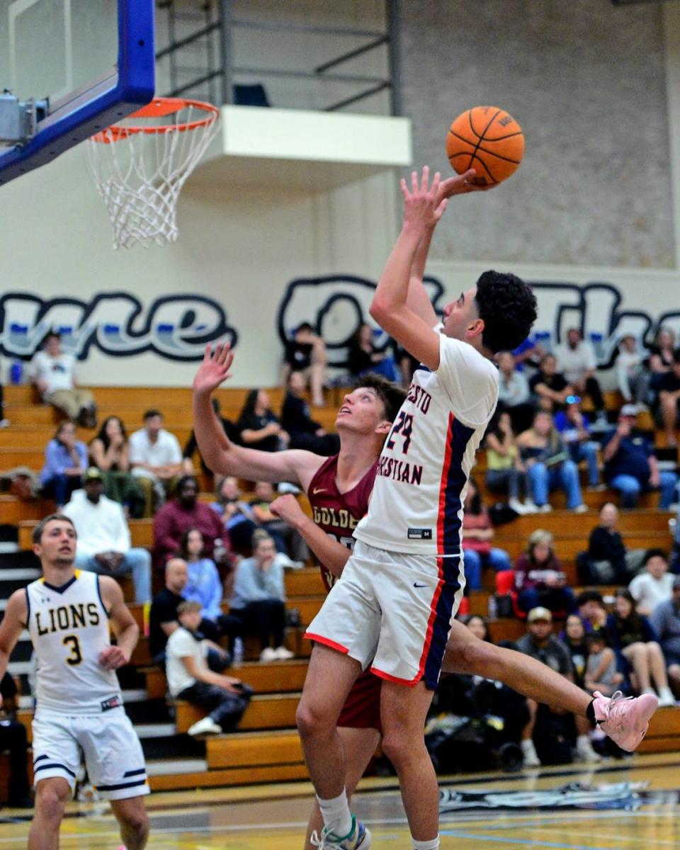 Modesto Christians Armon Naweed (24) shoots over a defender during the 27th Annual Six County All Star Senior Basketball Classic Boys game at Modesto Junior College in Modesto California on April 27, 2024. The Red team beat the Blue team 81-79.