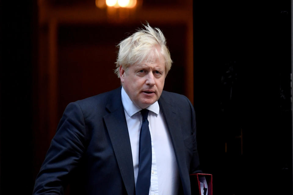 Britain's PM Johnson walks outside Downing Street in London (Toby Melville / Reuters)