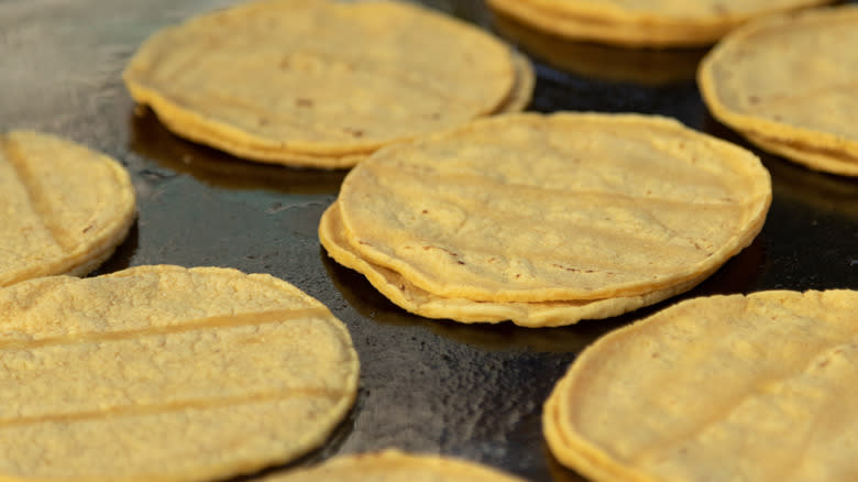 Mini corn tortillas on griddle