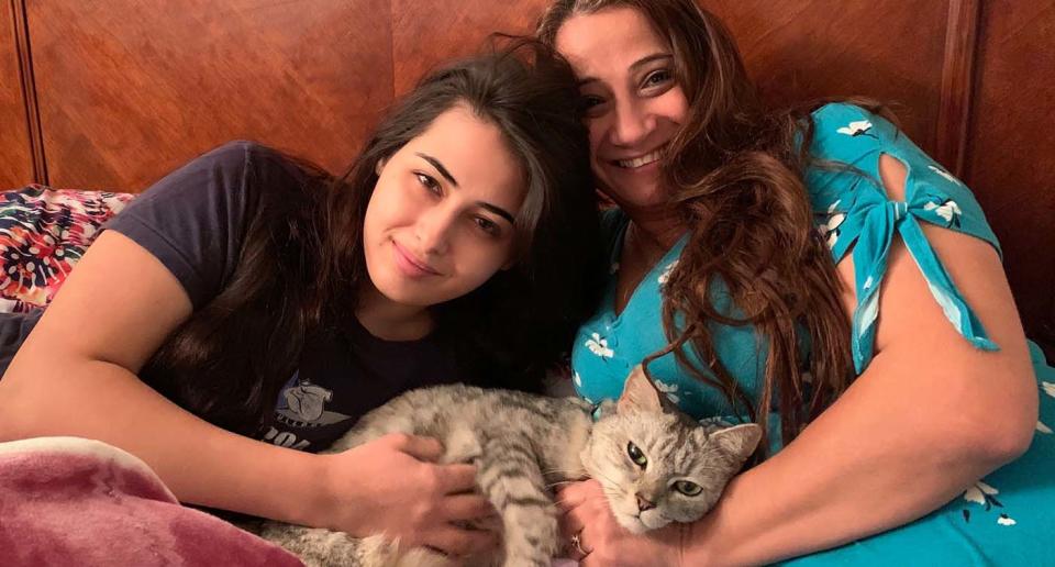 Cleo Kendirjian pictured with her mother Esther and cat Polar -- returned to them after three years. Source: Community Cat Carers Inc. 