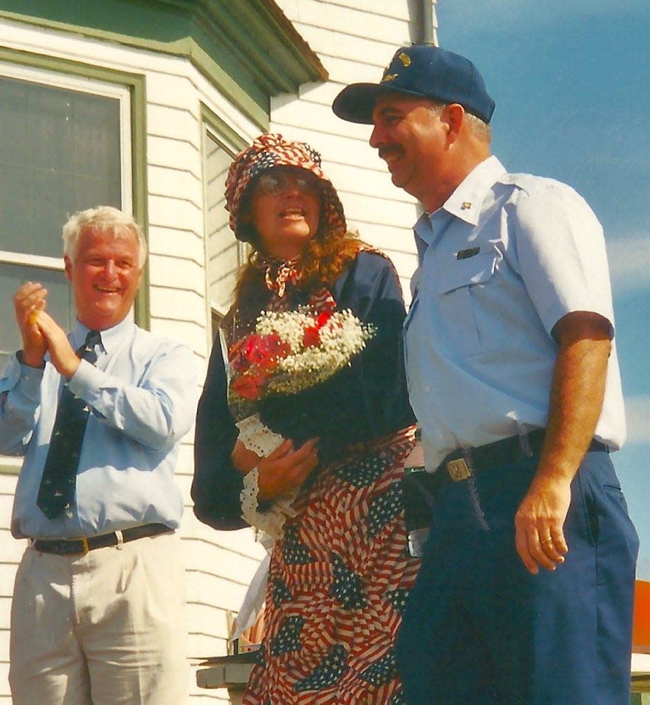 In September 2003, the U.S. Coast Guard announced the appointment of Sally Snowman, center, as the 70th keeper of Boston Light. Her husband, Jay Thomson, is on the right and U.S. Rep. William Delahunt, of Quincy, is on the left.