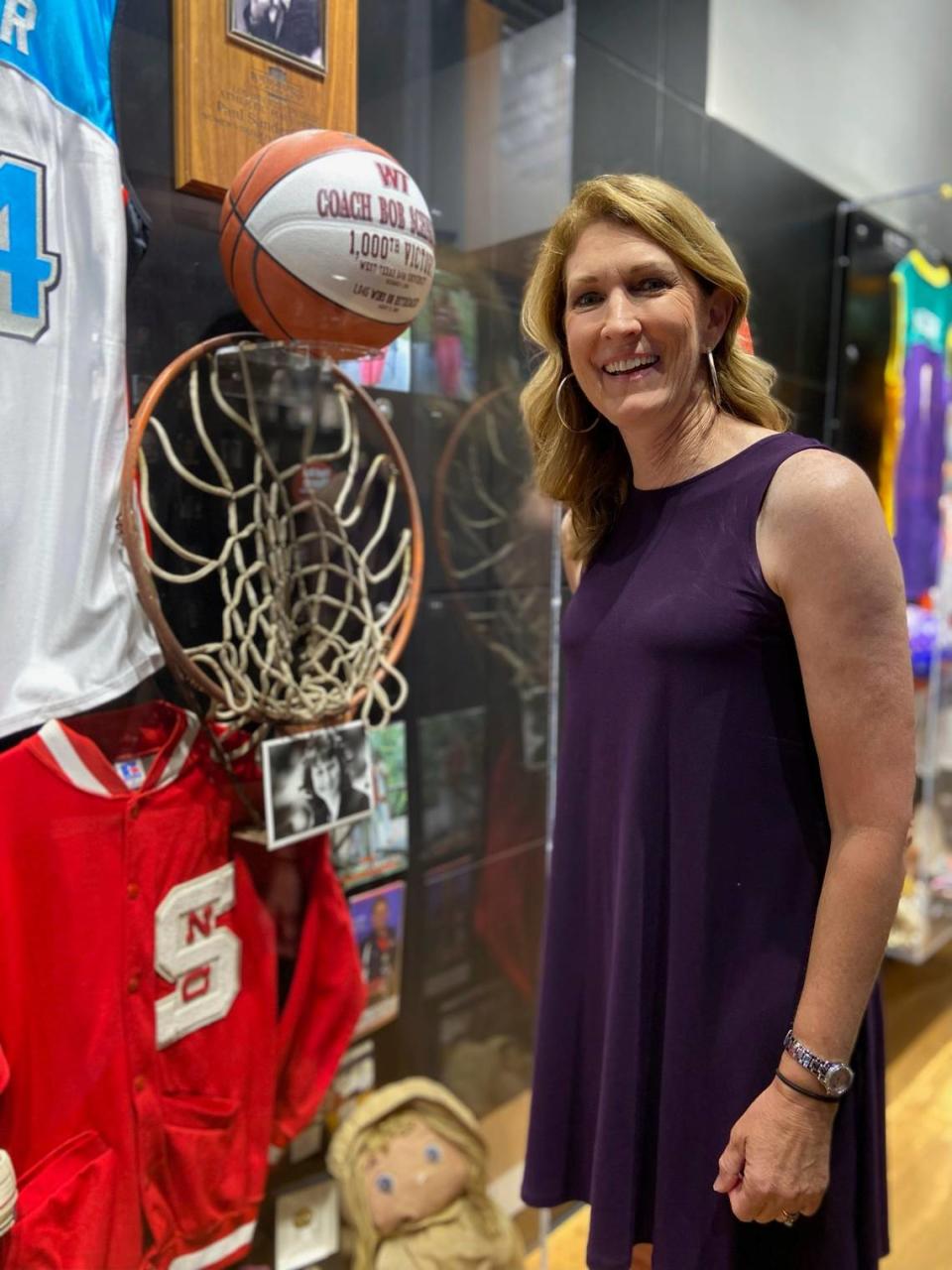 Debbie Antonelli, a 2022 inductee into the Women’s Basketball Hall of Fame as a contributor poses next to the hoop she used growing up, Saturday, June 11, 2022 in Knoxville, Tenn. Debbie Antonelli, Becky Hammon, Doug Bruno and Penny Taylor are among the 2022 inductees into the Women’s Basketball Hall of Fame.