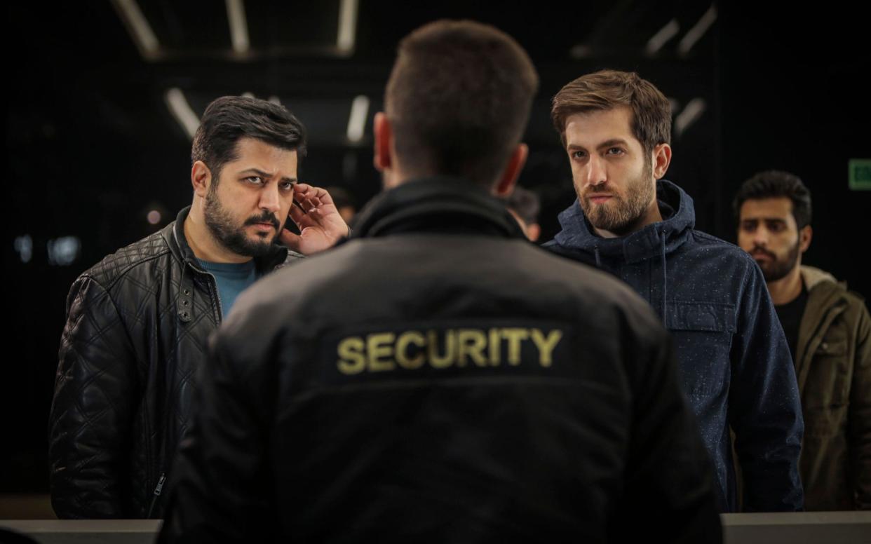 Iranian actors Pendar Akbari, left, and Ashkan Delavari, right, in a scene from the Iranian TV series 'Gando' - Bahar Asgari/Shahid Avini Cultural and Artistic Institute