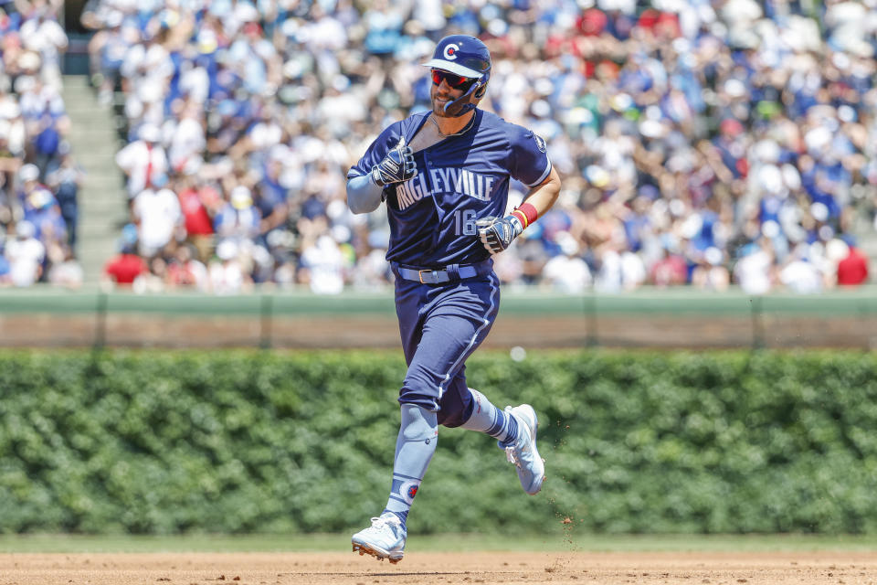 Chicago Cubs' Patrick Wisdom rounds the bases after hitting a three-run home run against the St. Louis Cardinals during the first inning of a baseball game, Friday, June 3, 2022, in Chicago. (AP Photo/Kamil Krzaczynski)