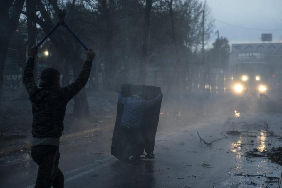 A Greek police water cannon operates from Kastanies border gate as migrants try to enter Greece from the Pazarkule border gate, Turkey at the Turkish-Greek border on Friday, March 6, 2020. Clashes erupted anew on the Greek-Turkish border Friday as migrants attempted to push through into Greece, while the European Union's foreign ministers held an emergency meeting to discuss the situation on the border and in Syria, where Turkish troops are fighting. (AP Photo)