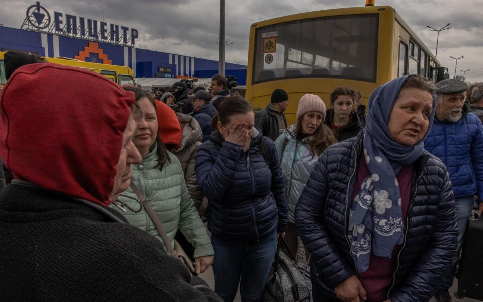 People from Mariupol gather after arriving on an evacuation bus in Zaporizhzhia, Ukraine, 21 April 2022.  - Roman Pilipey/Shutterstock