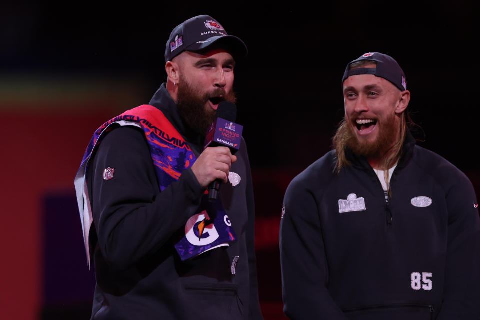 LAS VEGAS, NV - FEBRUARY 5: Travis Kelce #87 of the Kansas City Chiefs and George Kittle #85 of the San Francisco 49ers speaks with the media during Super Bowl LVIII Opening Night at Allegiant Stadium on February 5, 2024 in Las Vegas, NV. (Photo by Perry Knotts/Getty Images)