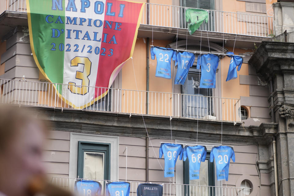 A view of the building adorned with Napoli soccer team jerseys in Naples, Italy, Thursday, May 4, 2023. (AP Photo/Andrew Medichini)