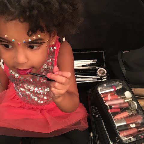 <p>Beyonce Instagram</p> Blue Ivy Carter putting on makeup