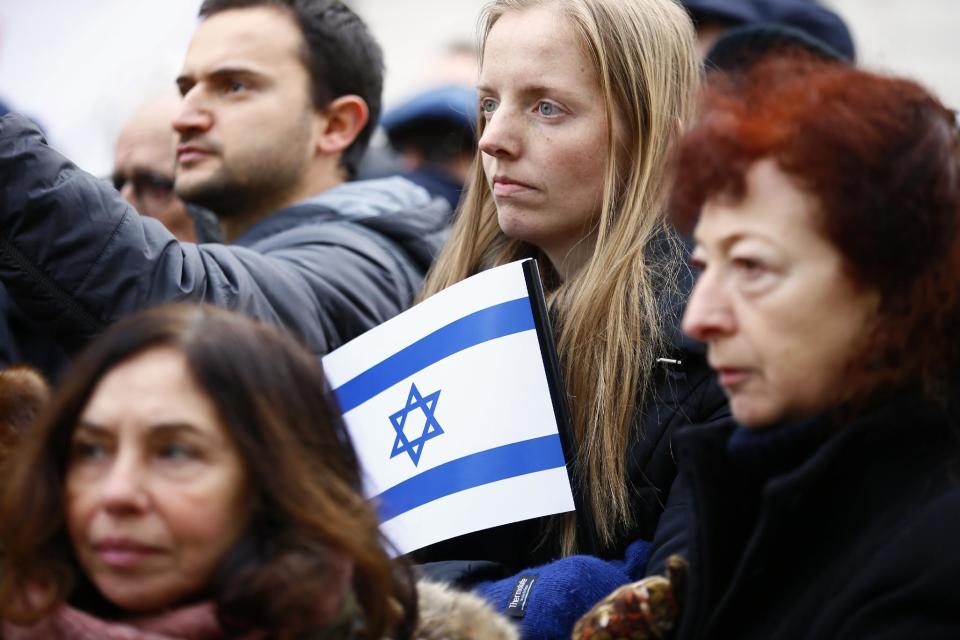 Pro-Israel demonstrators listen to speeches during a gathering in front of Israel embassy in Paris, France, Sunday, Jan. 15, 2017. Fearing a new eruption of violence in the Middle East, more than 70 world diplomats gathered in Paris on Sunday to push for renewed peace talks that would lead to a Palestinian state. (AP Photo/Francois Mori)