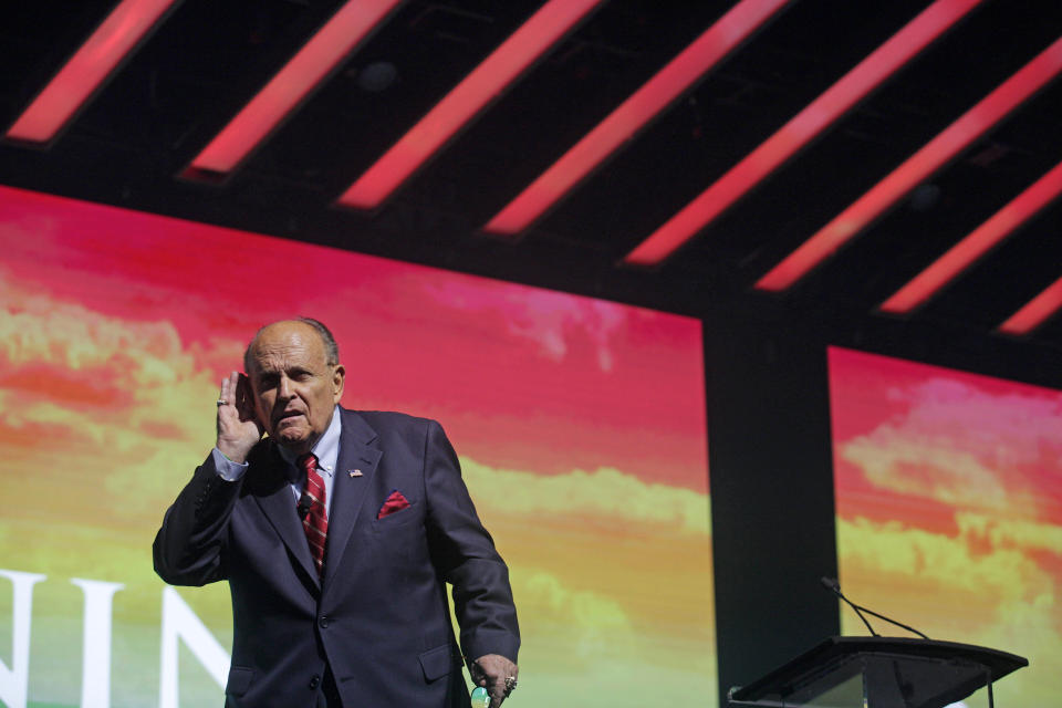 Rudy Giuliani, President Trump's personal attorney, addresses the conservative Turning Point USA Student Action Summit on Dec. 19 in Palm Beach, Florida. A member of Trump's defense team referred to Giuliani on Monday as the Democrats' "colorful distraction." (Photo: Saul Martinez/Getty Images)