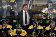 Boston Bruins head coach Bruce Cassidy yells from the bench during the second period of an NHL hockey game against the Buffalo Sabres, Saturday, Jan. 1, 2022, in Boston. (AP Photo/Mary Schwalm)