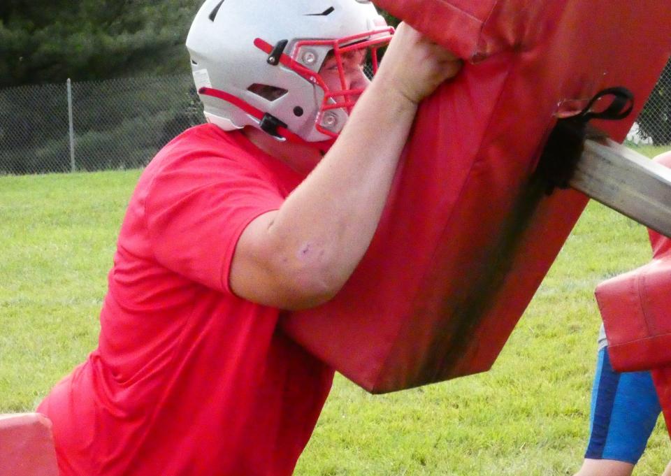 Utica junior Dylan Cooperider blocks a sled during a July camp. He has been a standout lineman since his freshman season.