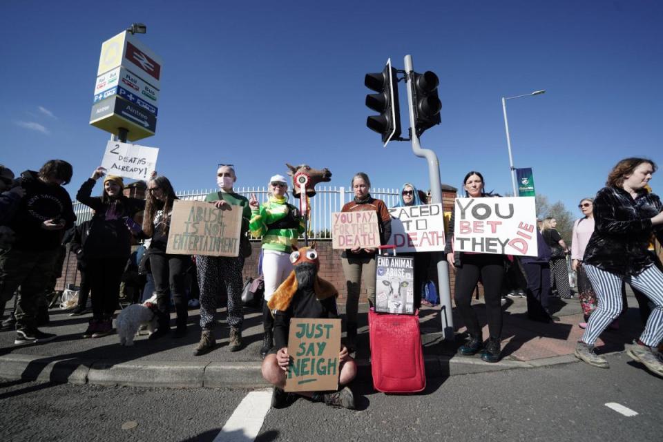 Animal Rising activists outside the gates ahead of day three of the Randox Grand National Festival at Aintree Racecourse i(Image: PA)/i