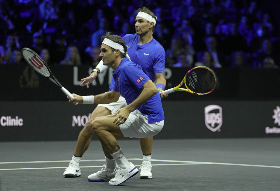 Team Europe's Roger Federer, front, and Rafael Nadal in action during their Laver Cup doubles match against Team World's Jack Sock and Frances Tiafoe at the O2 arena in London, Friday, Sept. 23, 2022. (AP Photo/Kin Cheung)