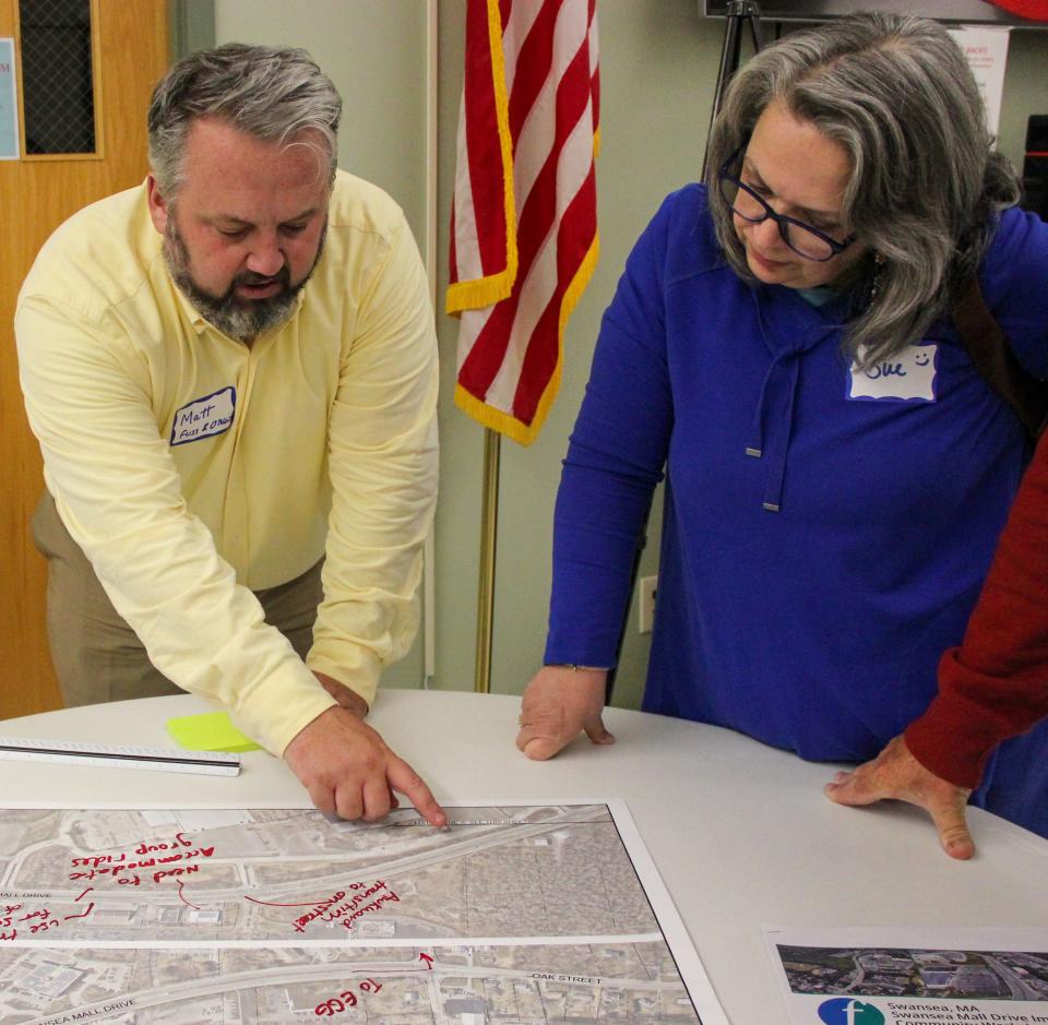 Matthew Skelly, a senior project manager with Fuss & O'Neill, and Swansea resident Sue Couitt look at a map of Swansea Mall Drive to talk about bicycle improvements to the area, during a public meeting held Tuesday, June 6, 2023, at the Swansea Council on Aging.