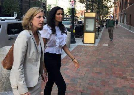 FILE PHOTO: Top Chef host Padma Lakshmi (C) enters federal court where she is expected to testify in the trial of four members of a local Teamsters union who tried to extort jobs from a non-union production company filming reality television show "Top Chef" in 2014 , in Boston, Massachusetts, U.S., August 7, 2017. REUTERS/Nate Raymond/File Photo