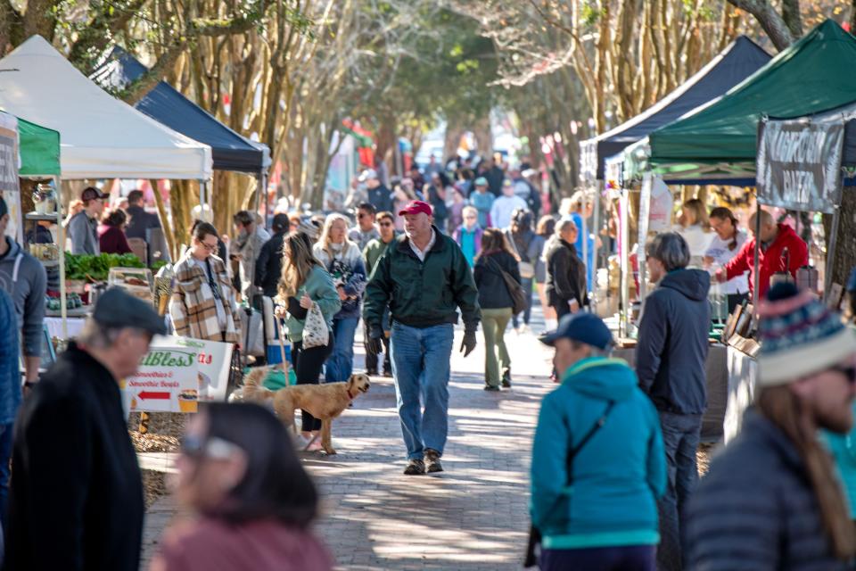 Shoppers check out the vendors at the Palafox Market Saturday, January 28, 2023 in Downtown Penscaola.