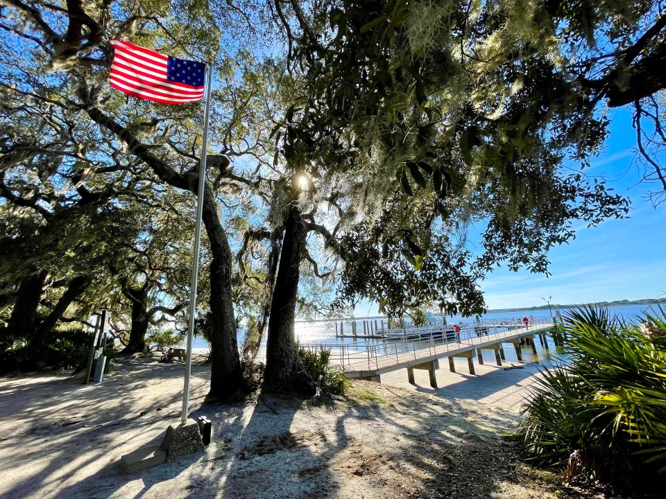 A flag flies at the Sea Camp dock on Cumberland Island National Seashore, one of the places where many of the island's mandated limit of visitors -- about 300 a day -- arrive.