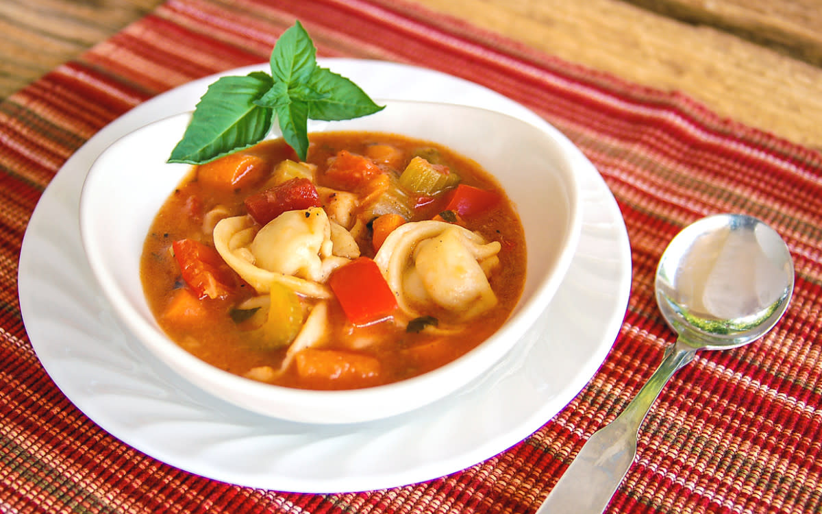 <p>Parade</p><p>With fire roasted tomatoes that bring in an added dimension of flavor, this vegetarian soup is full of hearty Italian pizzazz. </p><p><strong>Get the recipe: <a href="/26635/donnaelick/tortellini-and-vegetable-soup/" data-ylk="slk:30-Minute Tortellini and Vegetable Soup;elm:context_link;itc:0;sec:content-canvas" class="link rapid-noclick-resp">30-Minute Tortellini and Vegetable Soup</a></strong></p>