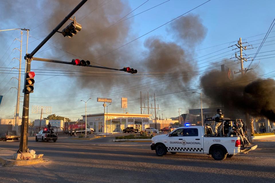 Members of the National Guard patrol the streets during an operation to arrest the son of Joaquin "El Chapo" Guzmán" Ovidio Guzmán, in Culiacan, Sinaloa state, Mexico, on Thursday.