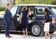 <p>Markle wore a <a class="link " href="http://meghansmirror.com/royal-style/royal-wedding/meghan-markle-doria-ragland-check-in-to-cliveden-house-hotel/" rel="nofollow noopener" target="_blank" data-ylk="slk:navy blue Roland Mouret dress;elm:context_link;itc:0;sec:content-canvas">navy blue Roland Mouret dress</a> and gray suede Manolo Blahnik pumps to her arrival at <a href="https://www.townandcountrymag.com/leisure/travel-guide/a9035896/cliveden-house/" rel="nofollow noopener" target="_blank" data-ylk="slk:Cliveden House;elm:context_link;itc:0;sec:content-canvas" class="link ">Cliveden House</a>, where she'll be staying the night before the wedding. </p>