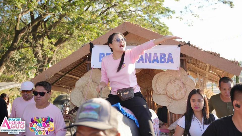 Mayor Alice Guo rides a carabao during a town fiesta