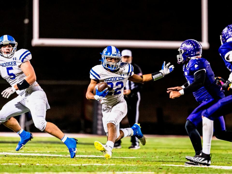 Freshman running back Justin Palacios carries the ball during Hooker's state semifinal win against Hominy.