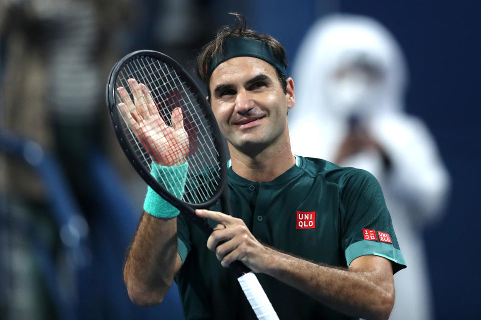 Roger Federer celebrates winning his match against Dan Evans in Doha, Qatar.