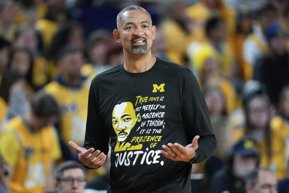 Michigan head coach Juwan Howard wears a Martin Luther King Jr. shirt in the first half of an NCAA college basketball game against Ohio State in Ann Arbor, Mich., Monday, Jan. 15, 2024. (AP Photo/Paul Sancya)