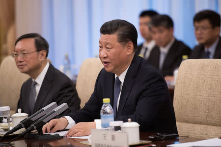 China's President Xi Jinping speaks with Japan's Prime Minister Shinzo Abe (not seen) during a meeting at the Diaoyutai State Guesthouse in Beijing, China October 26, 2018. Nicolas Asfouri/Pool via REUTERS