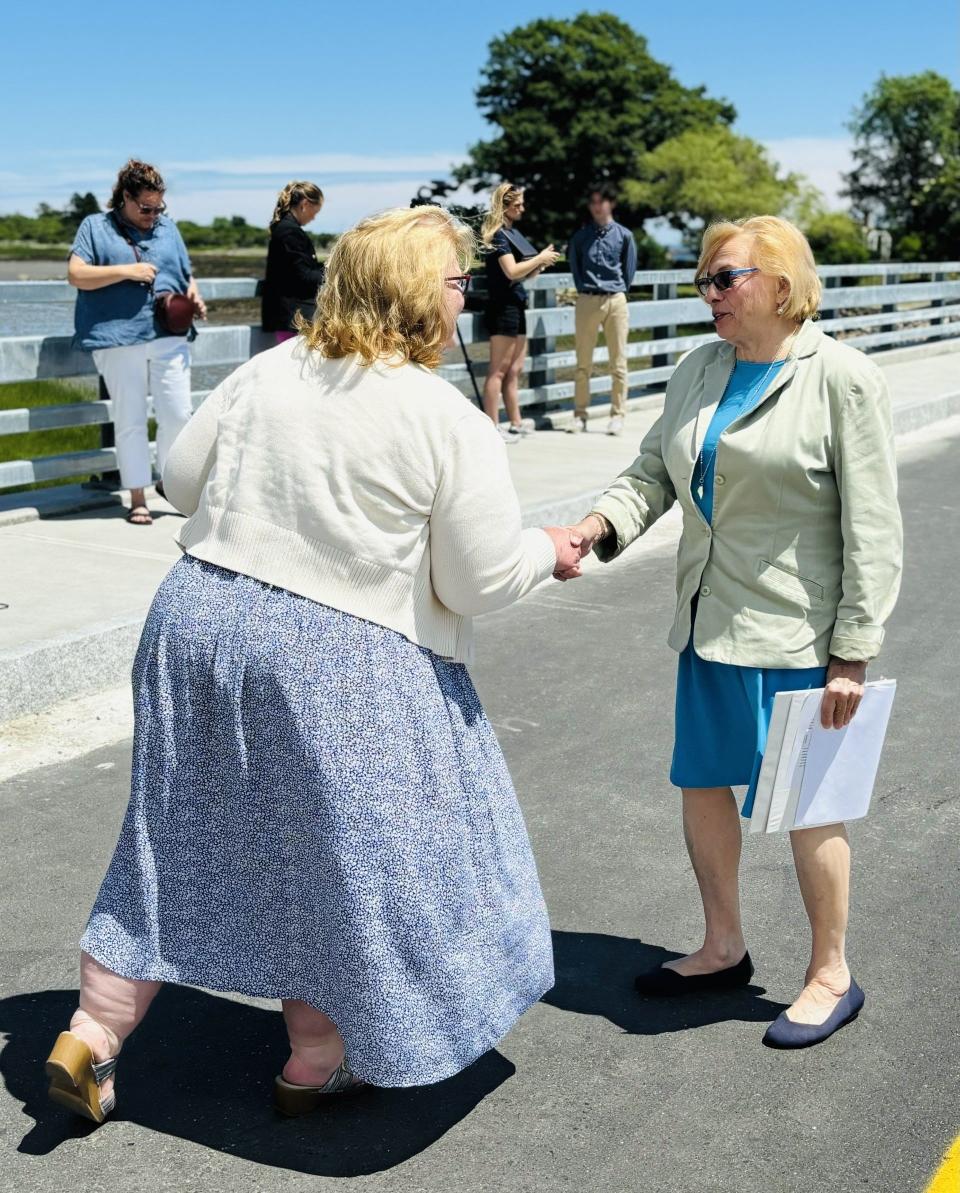 Kennebunkport Town Manager Laurie Smith, left, greets Maine Governor Janet Mills as she arrives at the ribbon-cutting ceremony for the new and improved Pier Road Causeway on Monday, July 1, 2024.