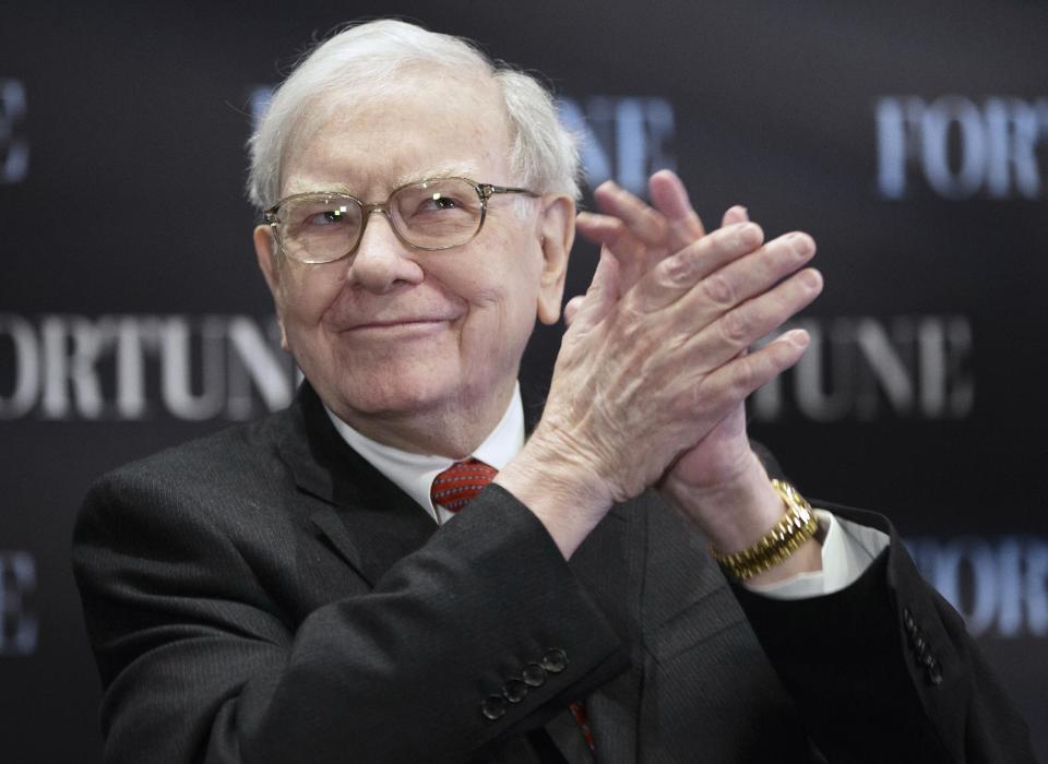 FILE - In this file photo from May 1, 2013, billionaire investor Warren Buffett applauds during a seminar in Omaha, Neb. Buffett’s failure to beat the stock market in four of the past five years has inspired debate about whether Berkshire Hathaway’s 83-year-old CEO has lost his touch. Buffett and Berkshire Vice Chairman Charlie Munger are likely to face questions about the conglomerate’s performance when more than 30,000 shareholders gather for the company’s annual meeting in Omaha on Saturday. (AP Photo/Nati Harnik, file)