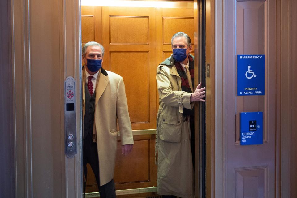 Bruce Castor Jr. (right), a member of former President Donald Trump's legal team, on Capitol Hill this week. He is one of the authors of a brief claiming rioters who attacked the U.S. Capitol last month did so &ldquo;of their own accord&rdquo; and not because Trump encouraged them.  (Photo: BRENDAN SMIALOWSKI via Getty Images)