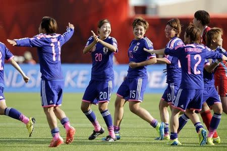 Jul 1, 2015; Edmonton, Alberta, CAN; Japan celebrates after beating England in the semifinals of the FIFA 2015 Women's World Cup at Commonwealth Stadium. Erich Schlegel-USA TODAY Sports