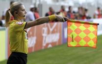 Brazil's referee assistant Fernanda Colombo Uliana attends the Brazilian championship soccer match between Atletico Mineiro and Cruzeiro in Belo Horizonte May 11, 2014. Uliana has just been granted FIFA official status by the refereeing committee of the Brazilian Football Confederation. REUTERS/Washington Alves (BRAZIL - Tags: SPORT SOCCER)