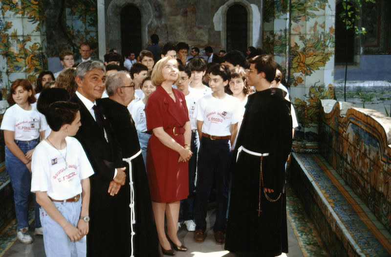 Hillary Clinton wearing a red dress in Italy on July 8, 1994