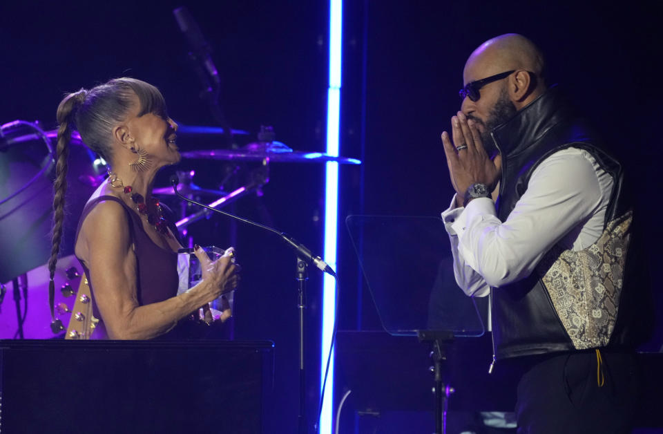 Swizz Beatz, right, presents the Recording Academy global impact award to Epic Records CEO Sylvia Rhone at the Black Music Collective on Thursday, Feb. 2, 2023, at The Hollywood Palladium in Los Angeles. (AP Photo/Chris Pizzello)