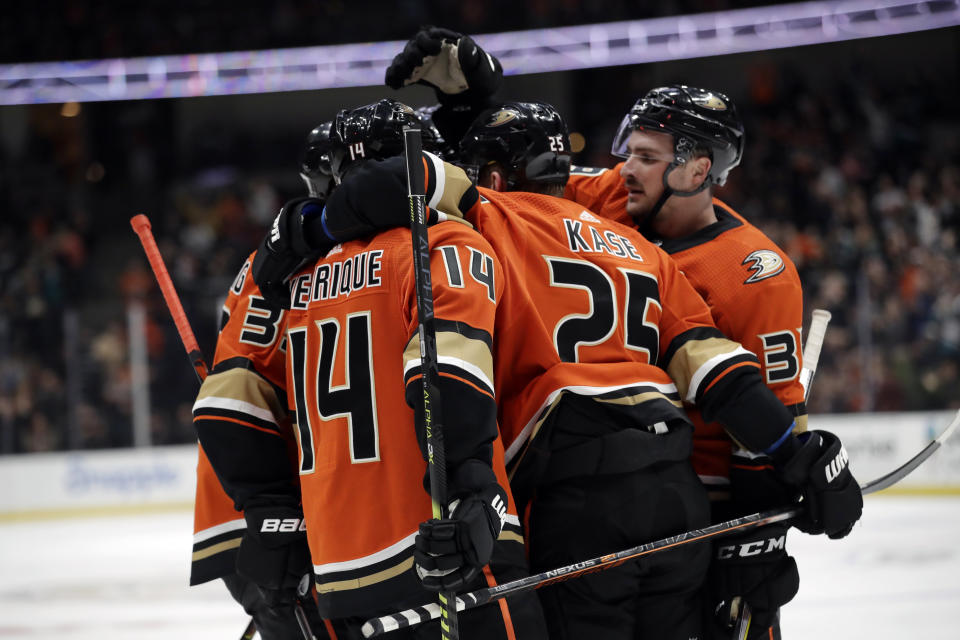 Anaheim Ducks' Adam Henrique (14) celebrates his goal with teammates during the second period of an NHL hockey game against the Vegas Golden Knights on Friday, Dec. 27, 2019, in Anaheim, Calif. (AP Photo/Marcio Jose Sanchez)