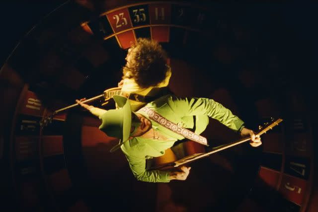 <p>Orville Peck/YouTube</p> Orville Peck and Beck perform together on a roulette wheel in "Death Valley High" music video