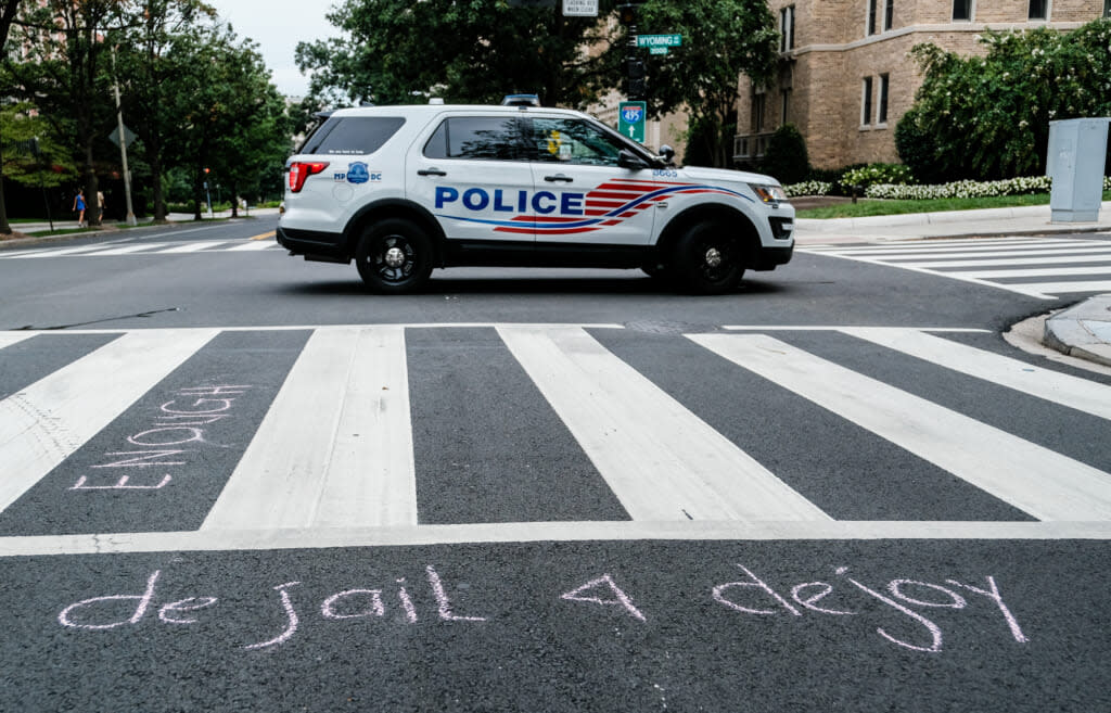 A Police car is seen outside of the condo of President Donald Trump donor and current U.S. Postmaster General Louis Dejoy on August 15, 2020 in Washington, DC. The protests are in response to a recent statement by President Trump to withhold USPS funding that would ensure that the post office would be unable handle mail-in voting ballots for the upcoming 2020 Election. (Photo by Michael A. McCoy/Getty Images)