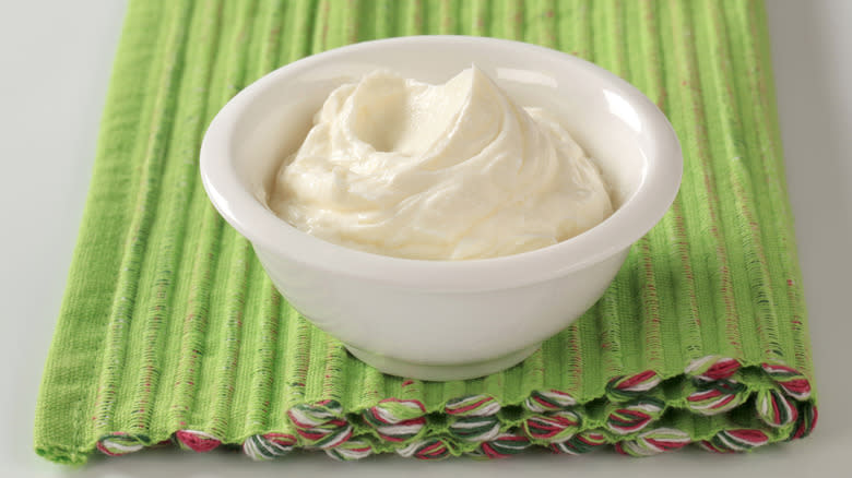 Bowl of cream cheese on a green mat